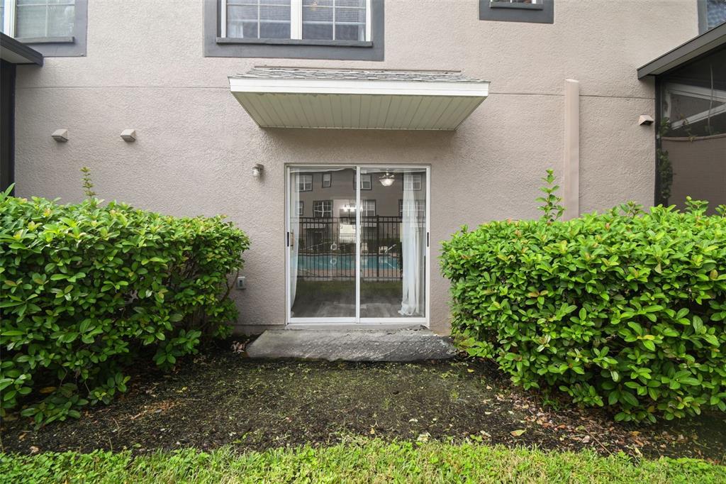 2503 Middleton Grove Drive Brandon, FL 33511 - Photo 37 of 39 a view of a house with potted plants and a yard