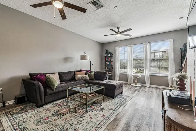a living room with furniture and a large window