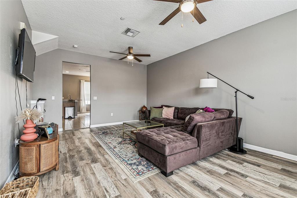 2503 Middleton Grove Drive Brandon, FL 33511 - Photo 9 of 39 a living room with furniture and a flat screen tv