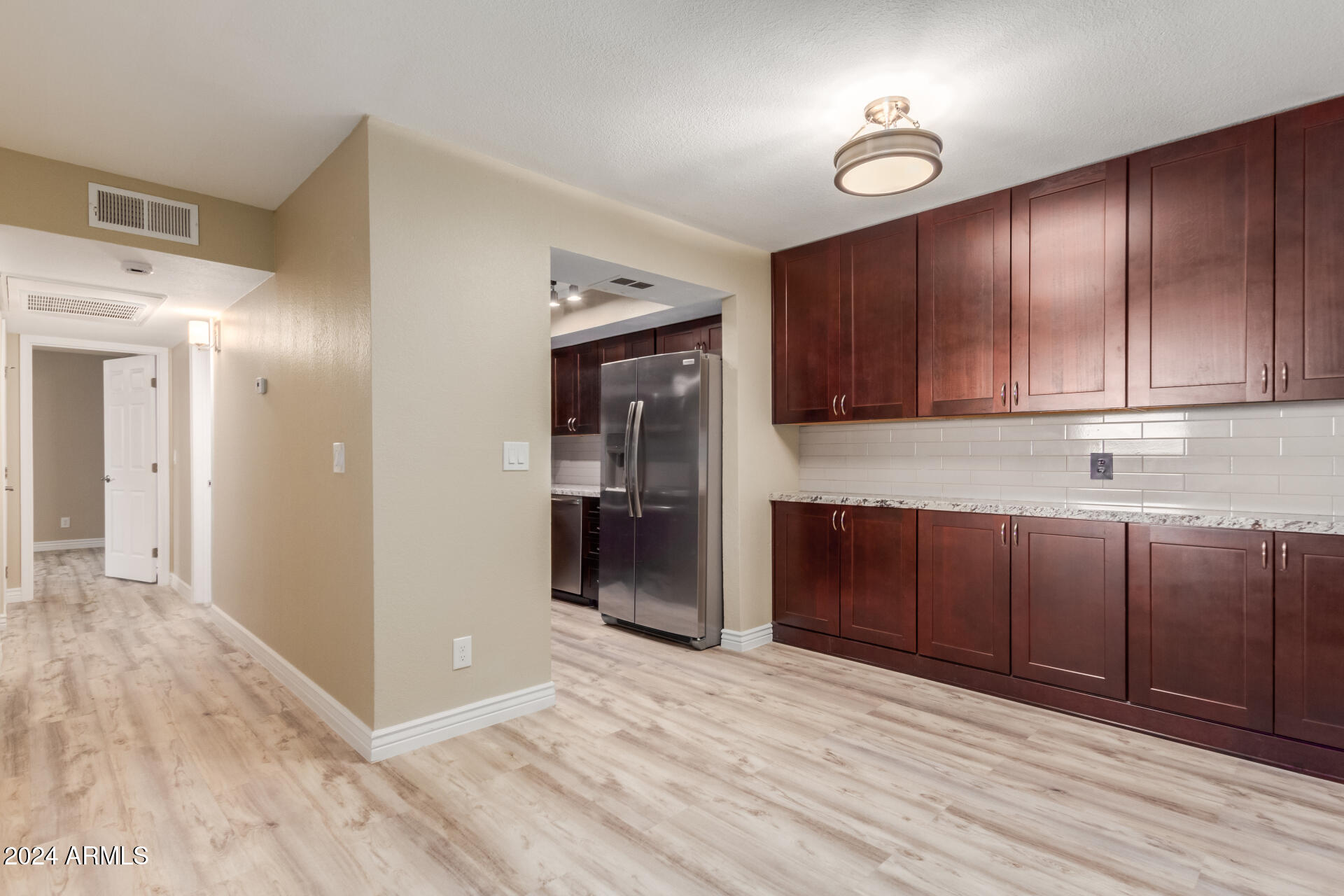 1340 North Recker Road, Unit 131 Mesa, AZ 85205 - Photo 7 of 25 great room into kitchen