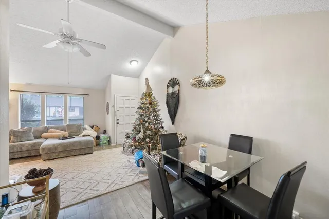 a dining room with furniture and window