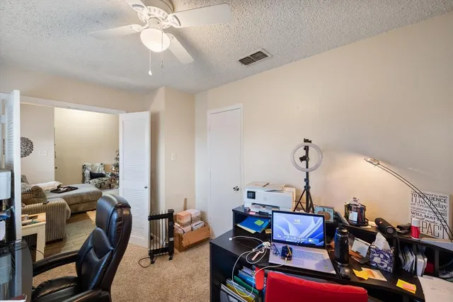 a view of a workspace with furniture