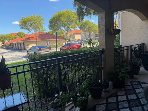 a view of a chairs and tables in patio