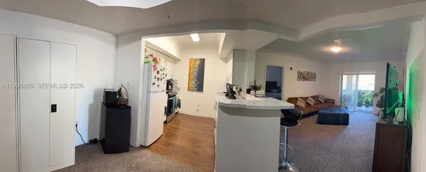 a view of a living room and a livingroom with furniture