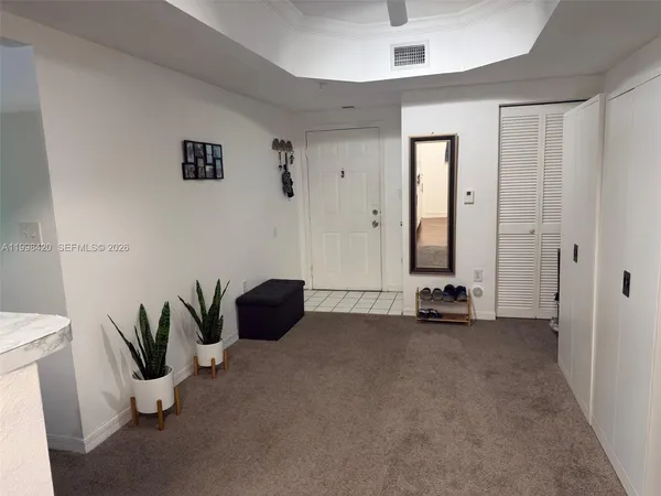 a view of livingroom with furniture and natural light