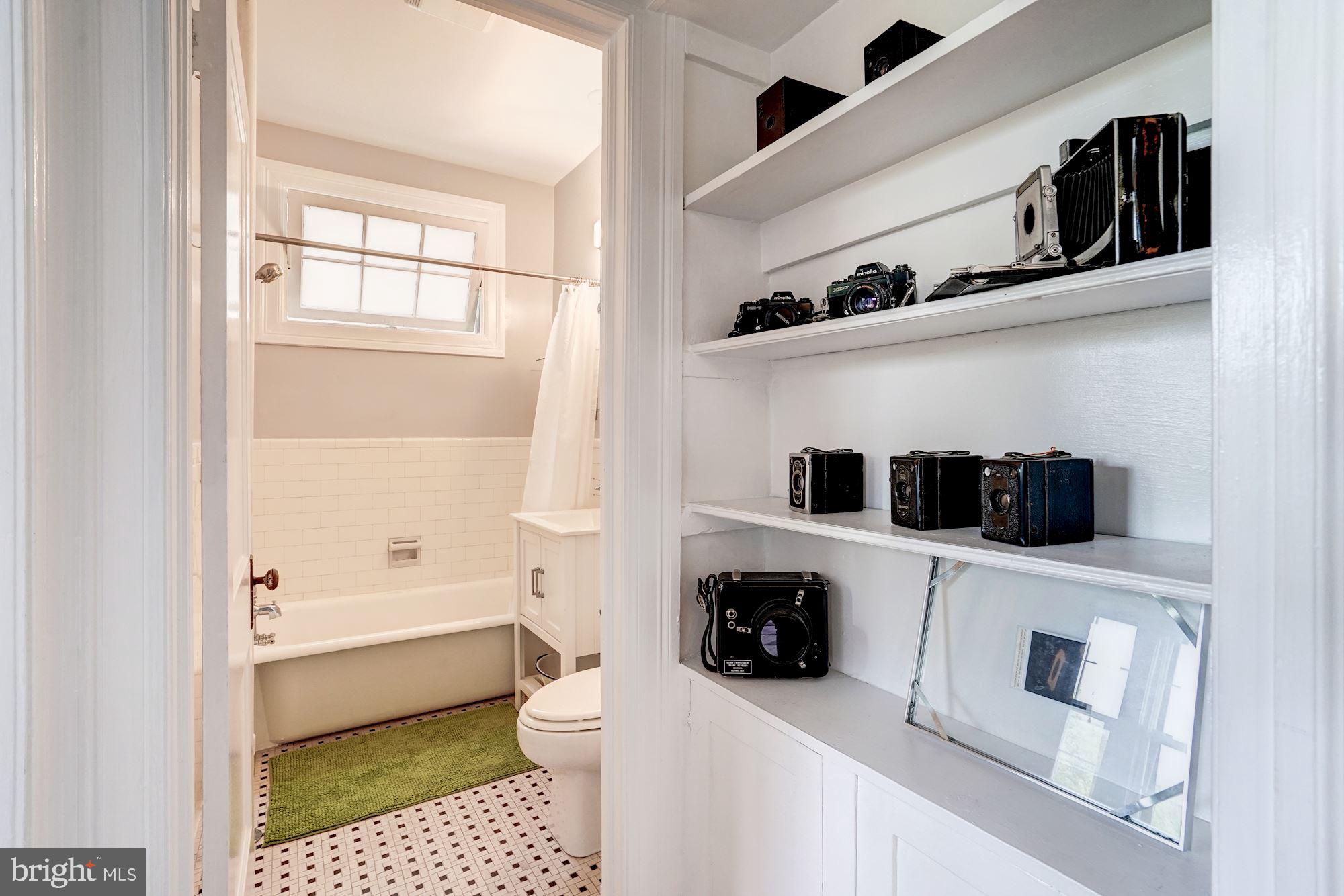 2707 Adams Mill Road Northwest, Unit 500 Washington, DC 20009 - Photo 21 of 52 Hallway built-ins and renovated bathroom