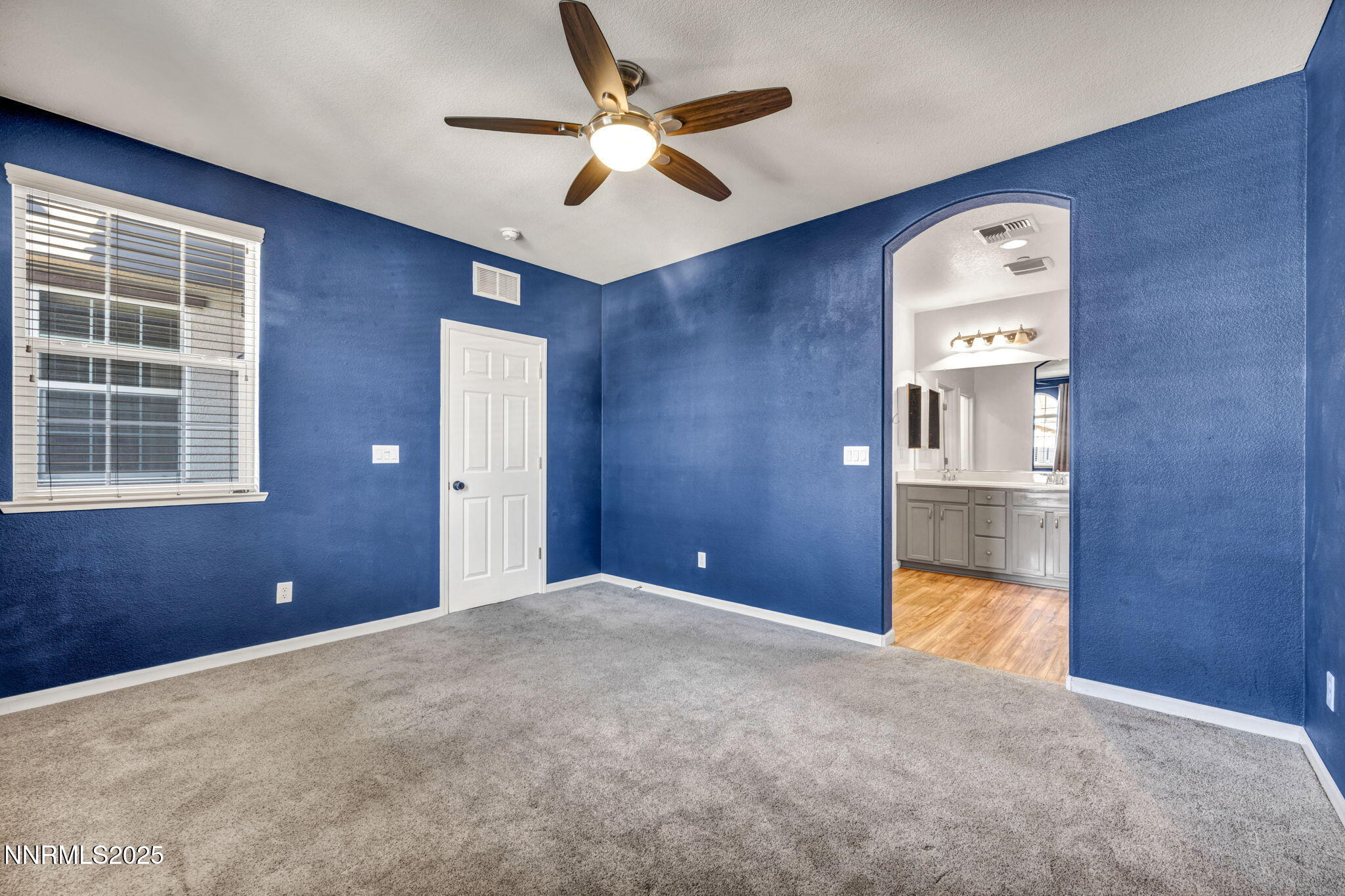 1864 Wind Ranch Road, Unit C Reno, NV 89521 - Photo 14 of 49 a view of a livingroom with a ceiling fan and a window