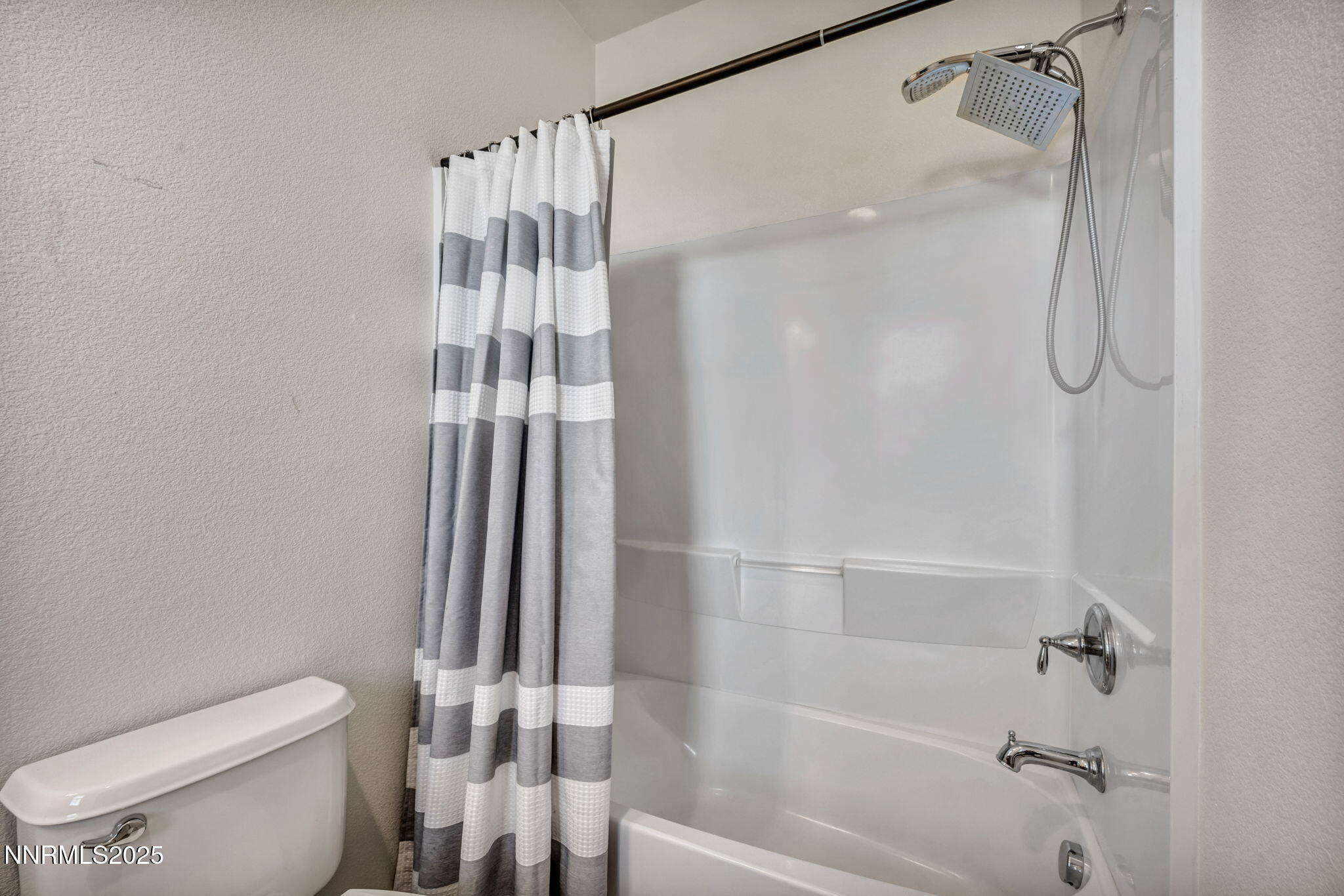 1864 Wind Ranch Road, Unit C Reno, NV 89521 - Photo 25 of 49 a bathroom with a shower and a toilet