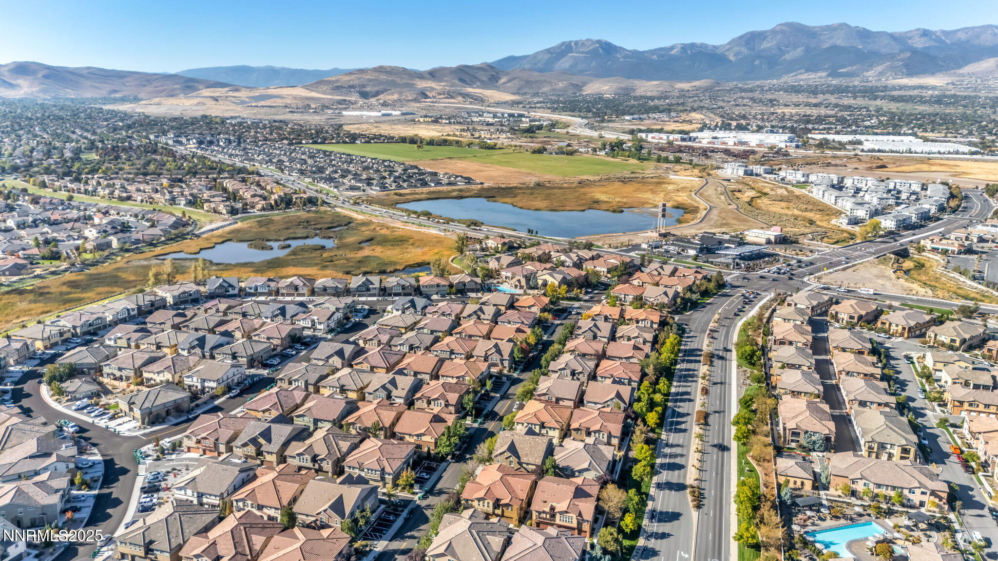 1864 Wind Ranch Road, Unit C Reno, NV 89521 - Photo 46 of 49 an aerial view of residential houses with outdoor space and river