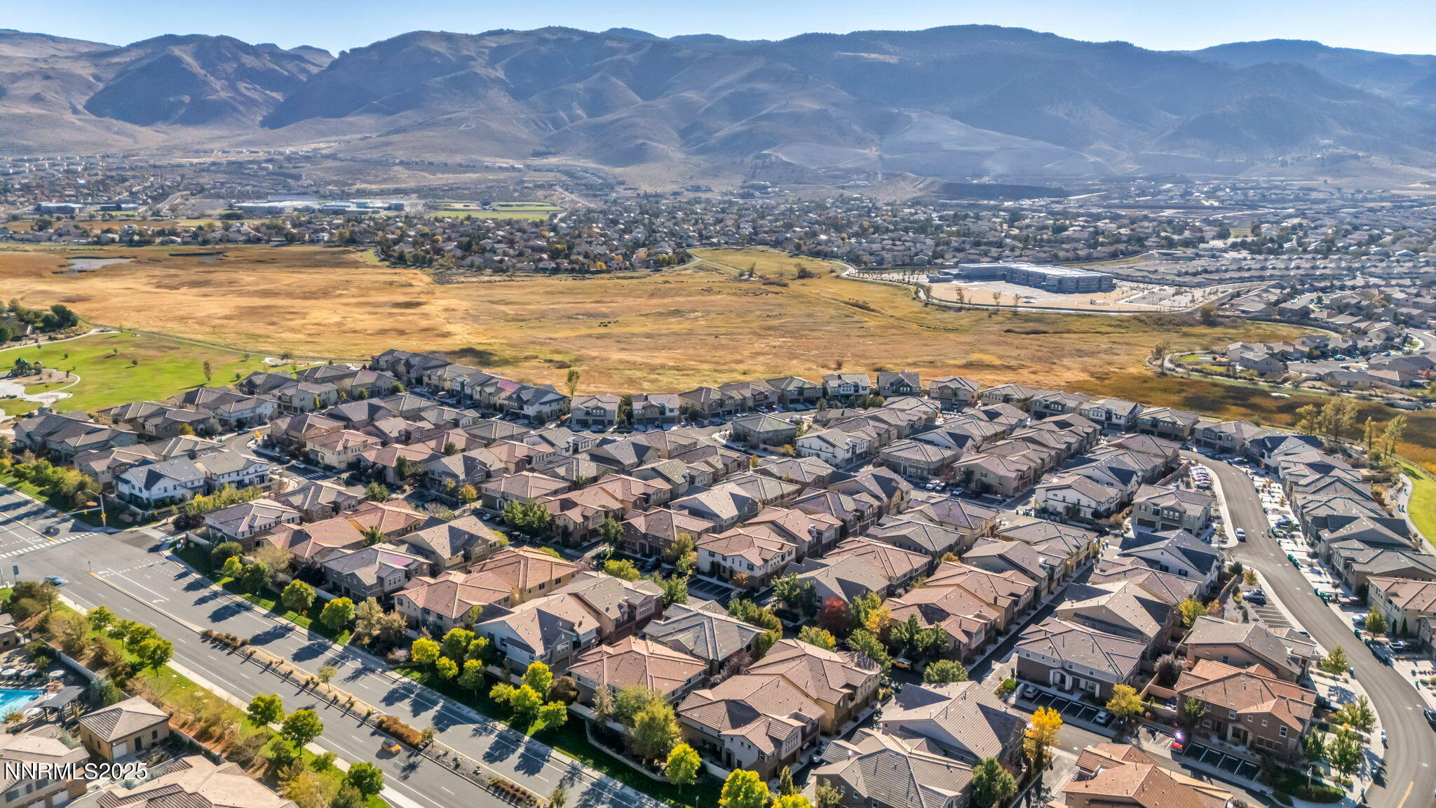 1864 Wind Ranch Road, Unit C Reno, NV 89521 - Photo 48 of 49 a view of a city with mountains in the background