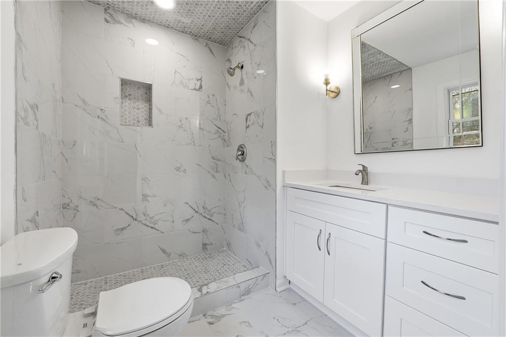 2520 Overlook Way Northeast Atlanta, GA 30345 - Photo 20 of 31 a bathroom with a sink a toilet and shower