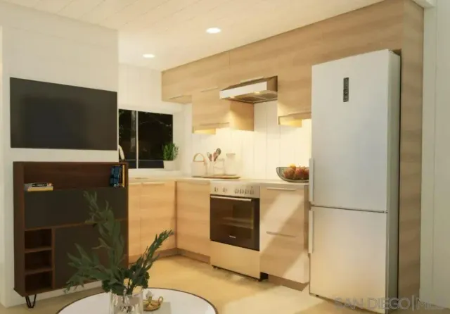 a kitchen with stainless steel appliances granite countertop a refrigerator and a stove