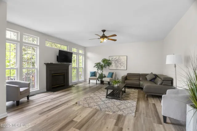a view of a dining room with furniture window and wooden floor