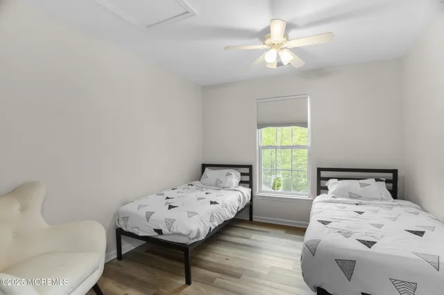 a view of a swimming pool and trees in the background