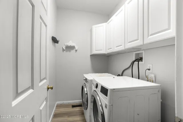 a view of a backyard with a slide trees and wooden fence