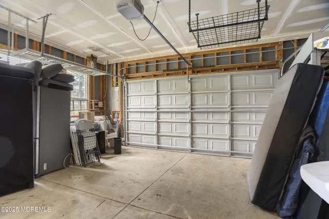 a view of a swimming pool with lawn chairs and a big yard