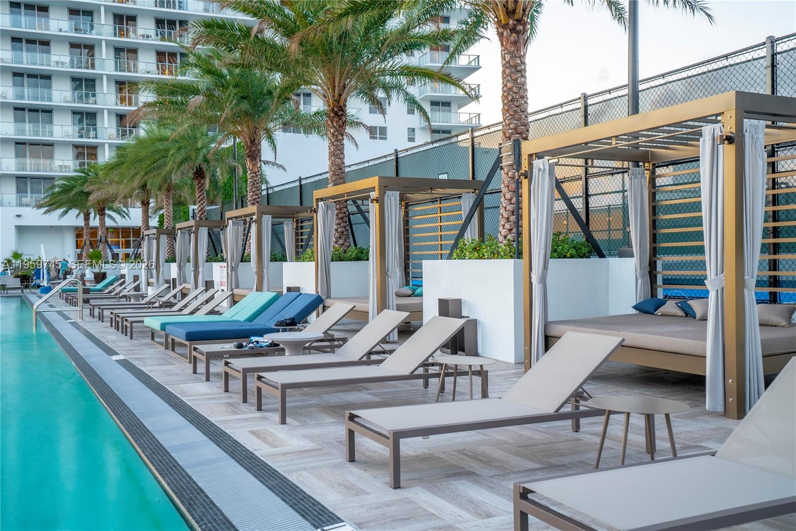 4010 South Ocean Drive, Unit R2301 Hollywood, FL 33019 - Photo 30 of 33 a swimming pool with outdoor seating