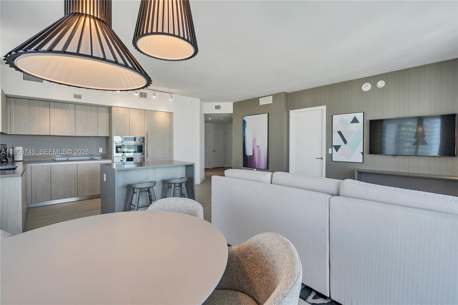 4010 South Ocean Drive, Unit R2301 Hollywood, FL 33019 - Photo 9 of 33 a kitchen with furniture a sink and a chandelier