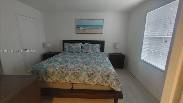 a room with a bed and a window