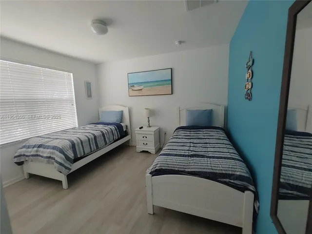 a view of a dining room with furniture and window