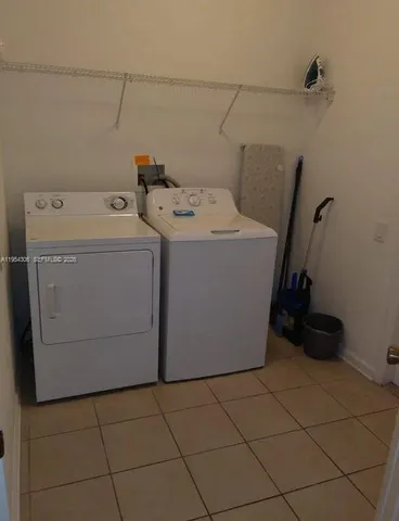 a kitchen with a sink appliances and cabinets
