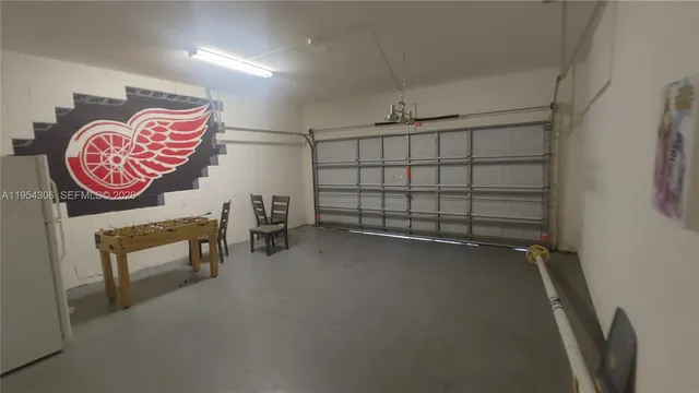 a backyard of a house with yard barbeque oven and outdoor seating