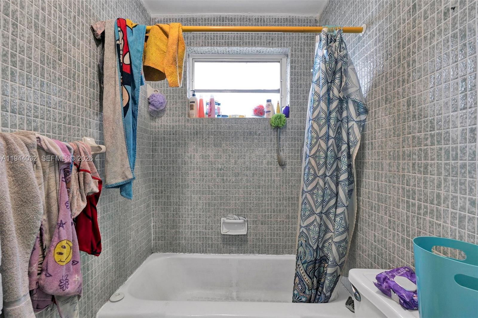 1900 Northwest 88th Street Miami, FL 33147 - Photo 14 of 31 a bathroom with a bathtub and a shower