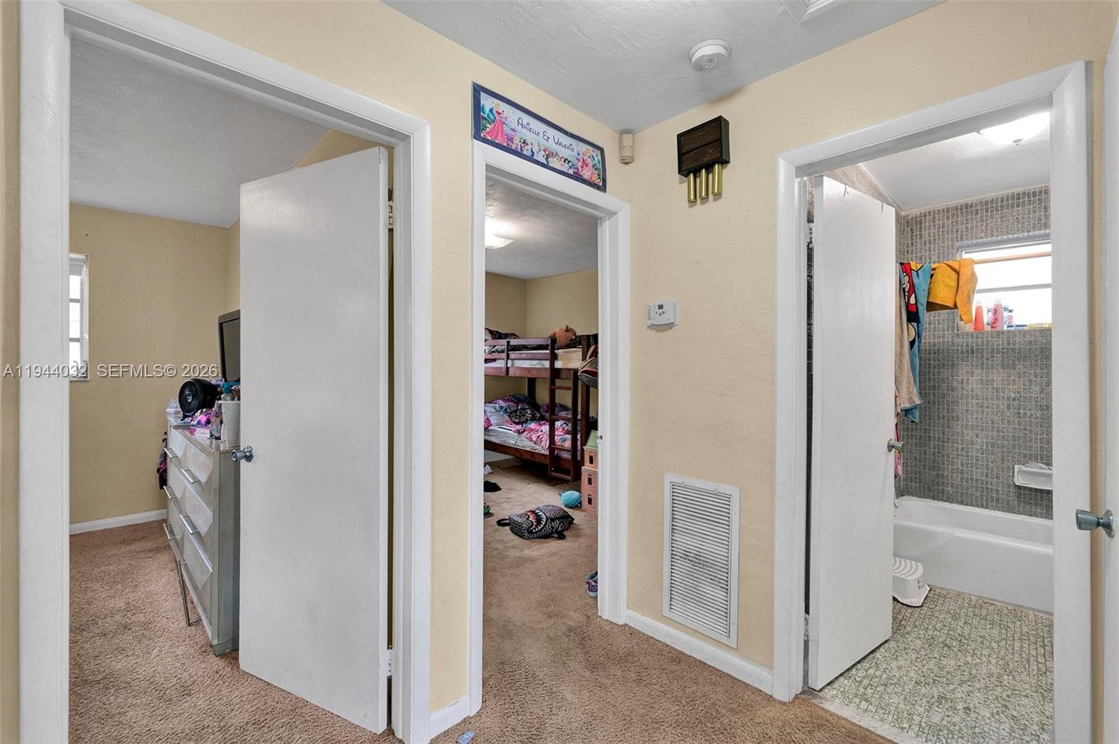 1900 Northwest 88th Street Miami, FL 33147 - Photo 17 of 31 a view of a hallway with bathroom and shower