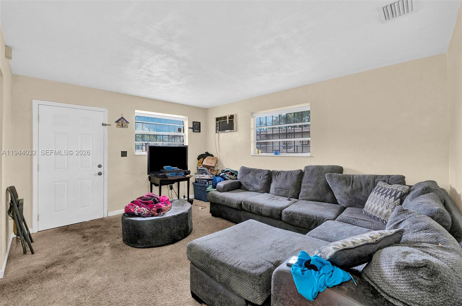 1900 Northwest 88th Street Miami, FL 33147 - Photo 18 of 31 a living room with furniture and a window