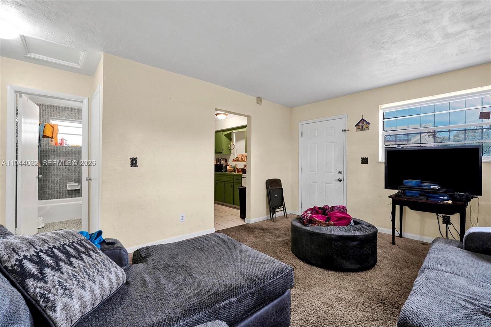 1900 Northwest 88th Street Miami, FL 33147 - Photo 21 of 31 a bedroom with furniture and a bed