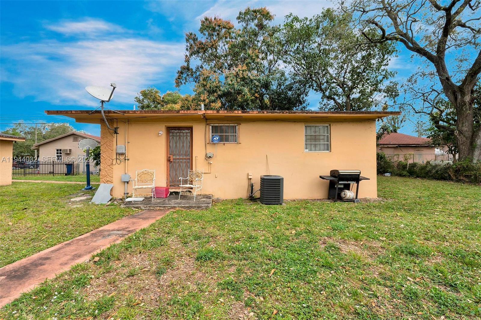 1900 Northwest 88th Street Miami, FL 33147 - Photo 22 of 31 a house that has yard in front of it
