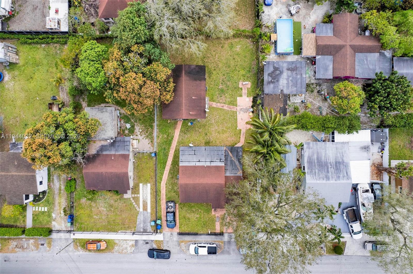 1900 Northwest 88th Street Miami, FL 33147 - Photo 26 of 31 an aerial view of multiple houses with a yard