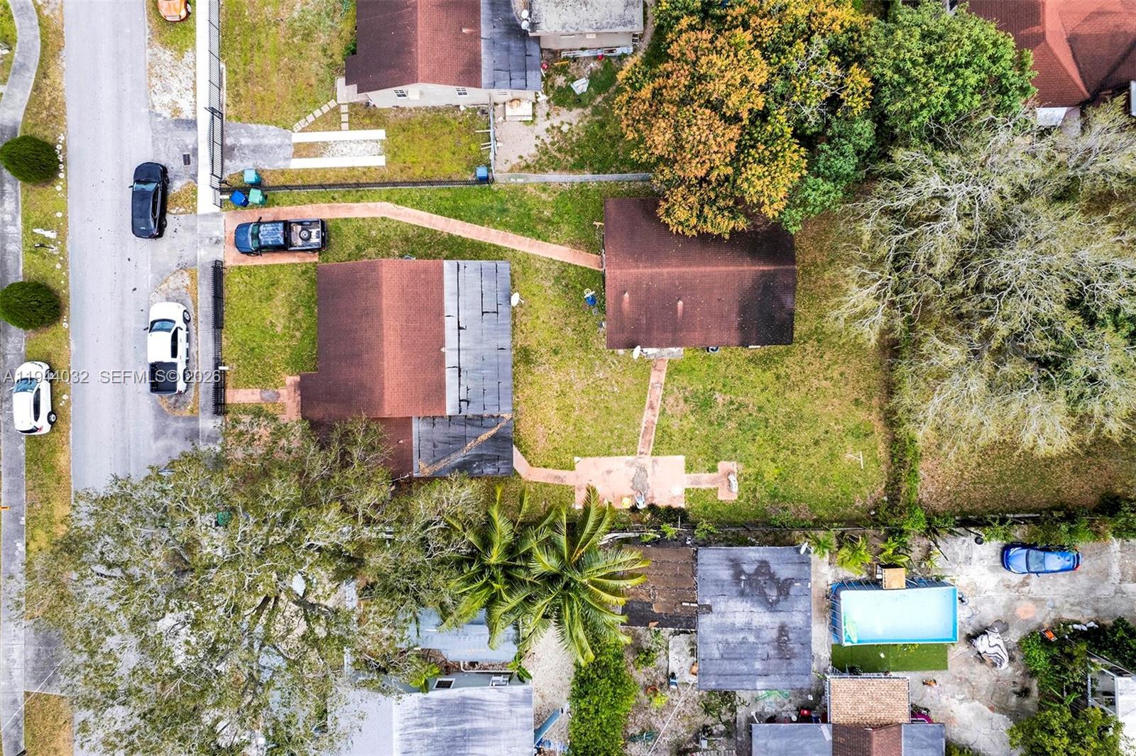 1900 Northwest 88th Street Miami, FL 33147 - Photo 27 of 31 an aerial view of a house with a yard and a fountain