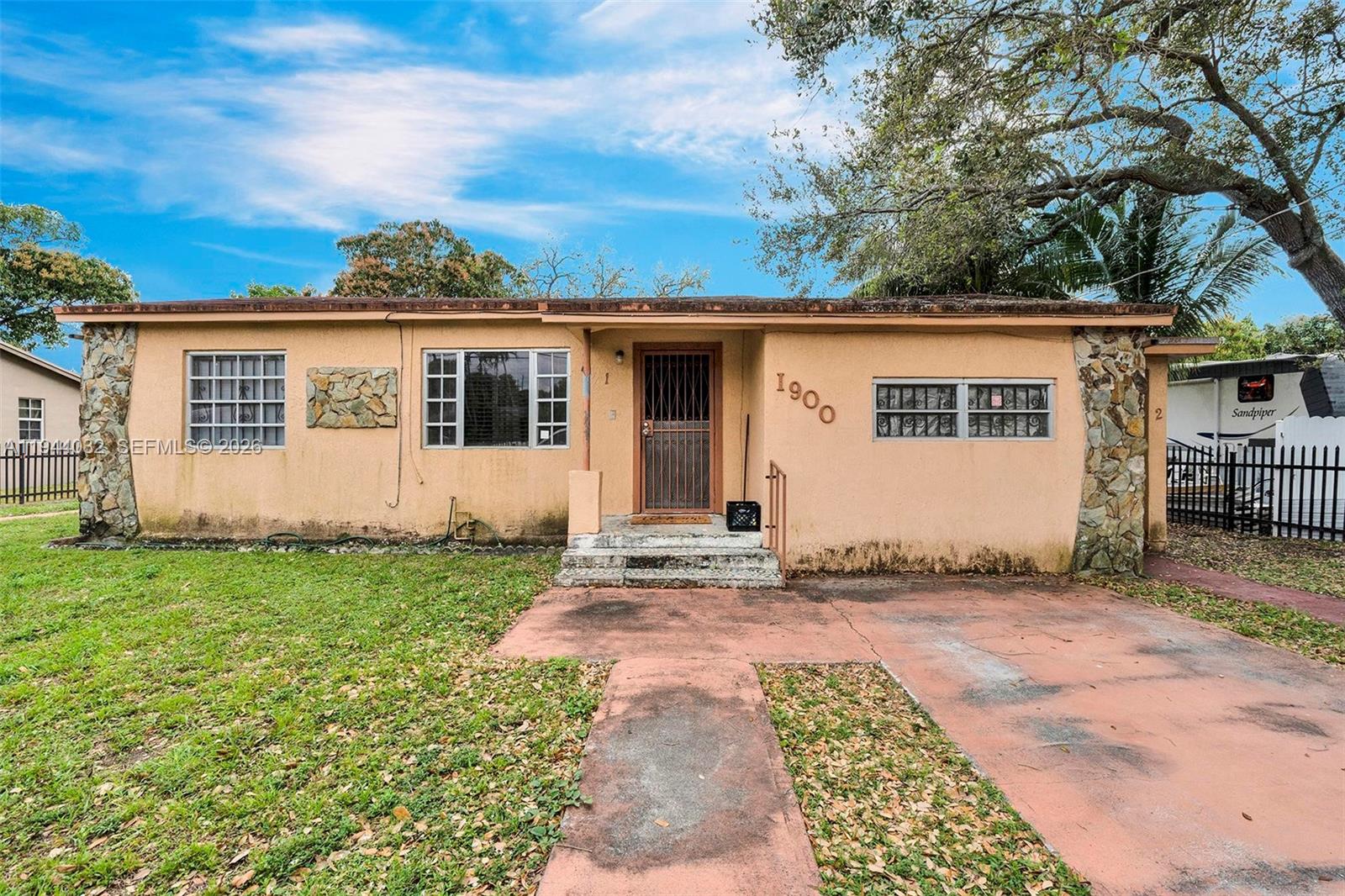1900 Northwest 88th Street Miami, FL 33147 - Photo 3 of 31 a view of a house with a garden