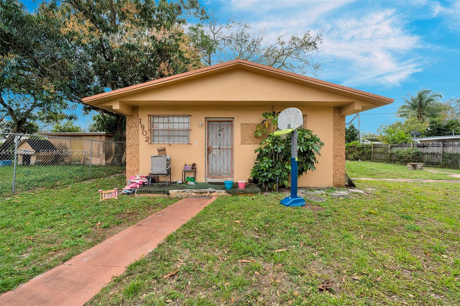 1900 Northwest 88th Street Miami, FL 33147 - Photo 7 of 31 a view of a house with backyard