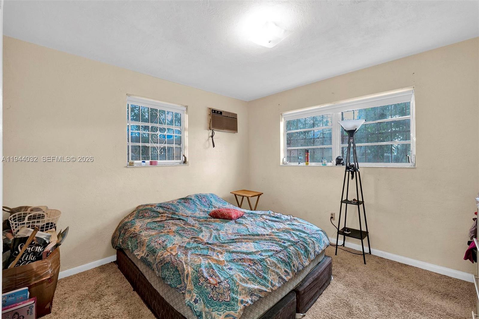 1900 Northwest 88th Street Miami, FL 33147 - Photo 10 of 31 a bedroom with a bed and a window