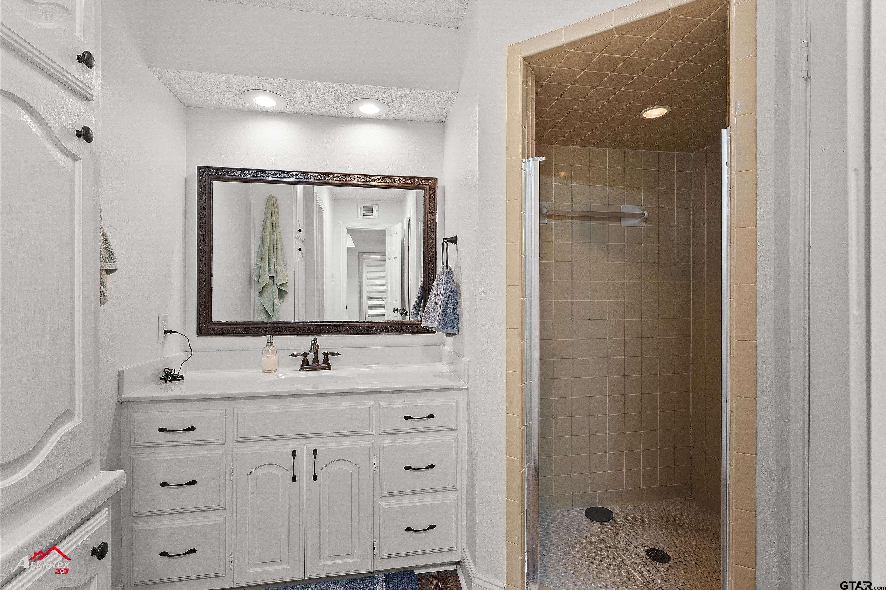 914 Regency Drive Longview, TX 75604 - Photo 14 of 35 a bathroom with a double vanity sink mirror and double