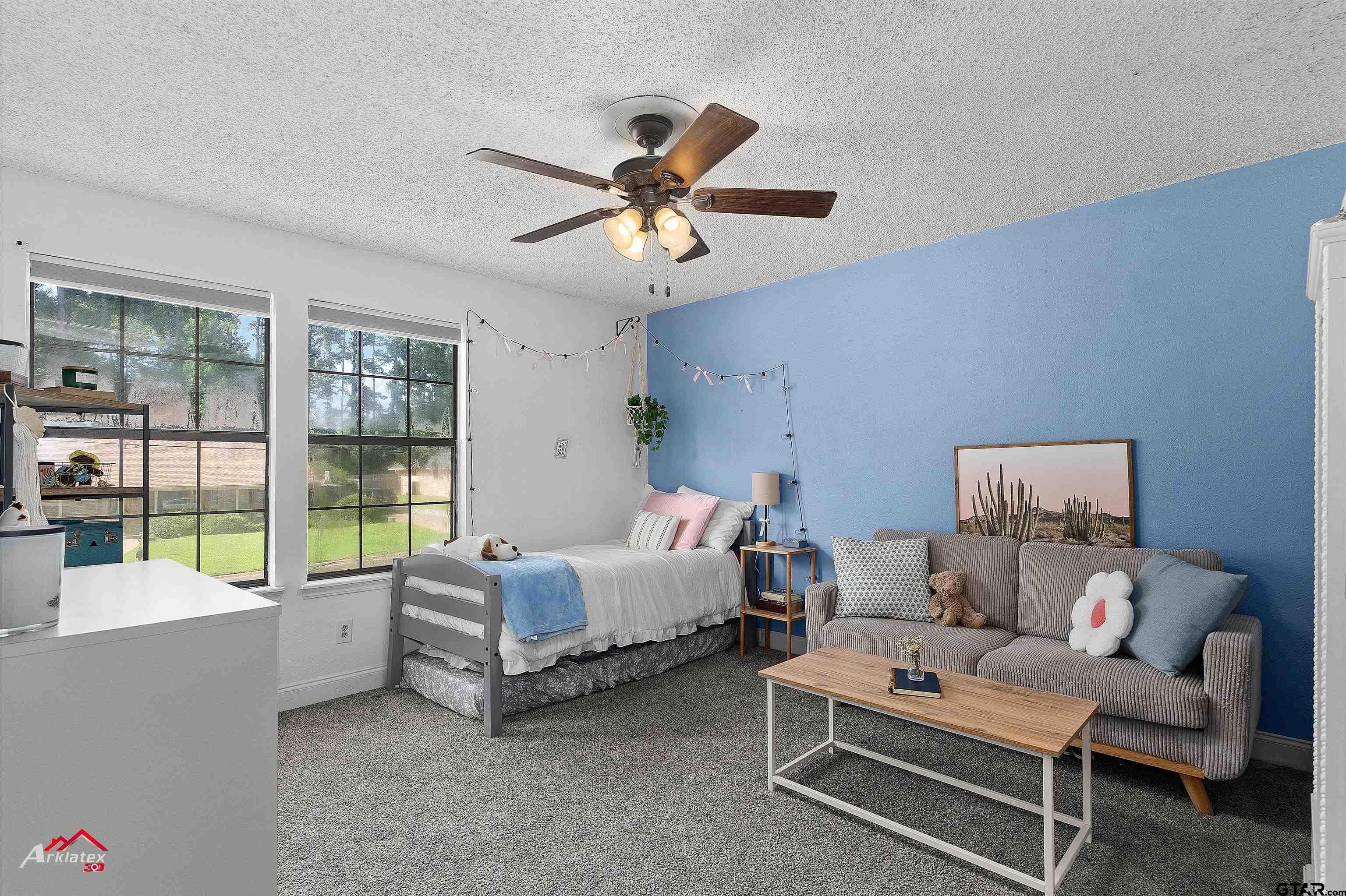 914 Regency Drive Longview, TX 75604 - Photo 16 of 35 a living room with furniture and a floor to ceiling window