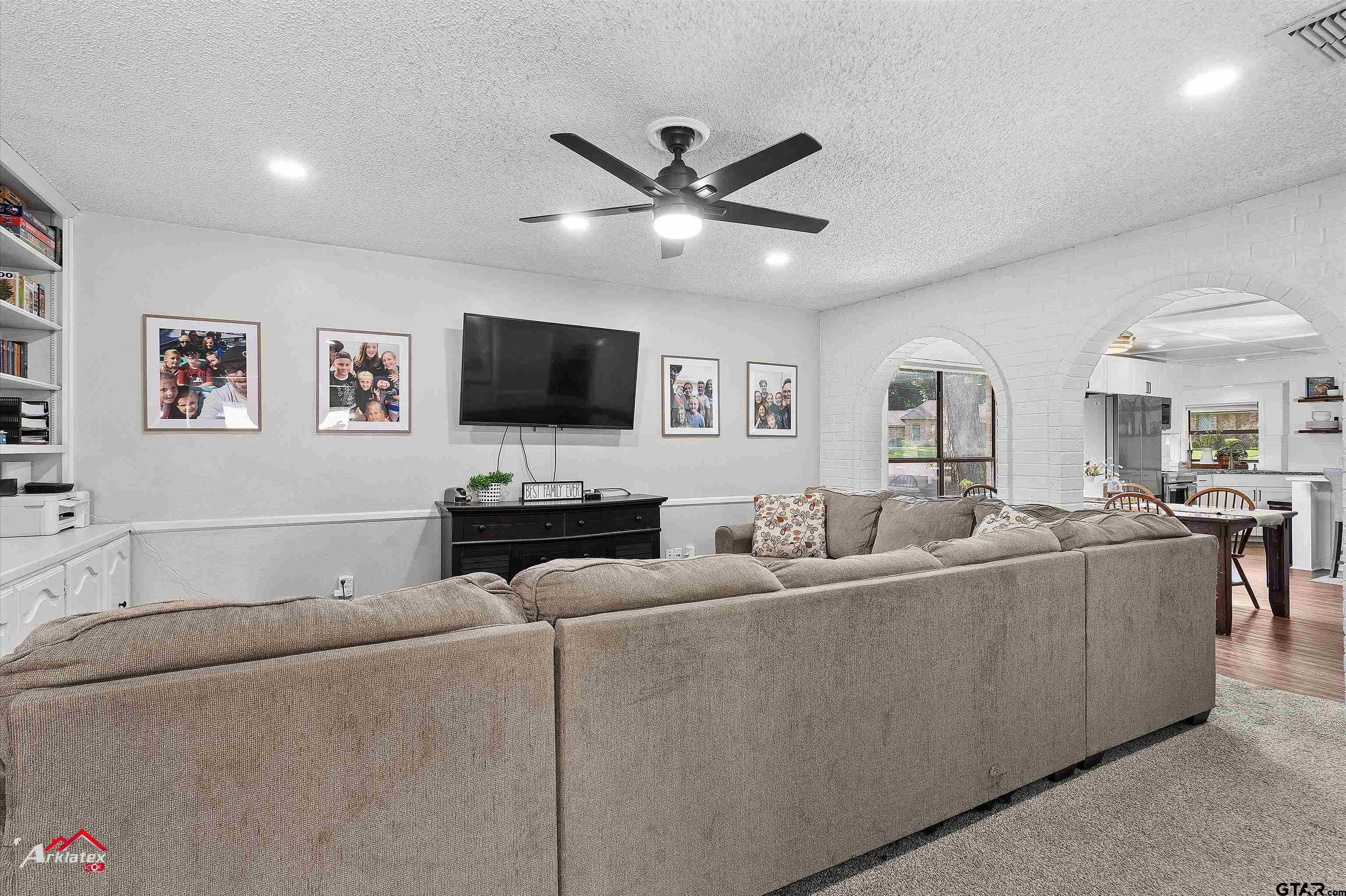 914 Regency Drive Longview, TX 75604 - Photo 21 of 35 a living room with furniture and a flat screen tv