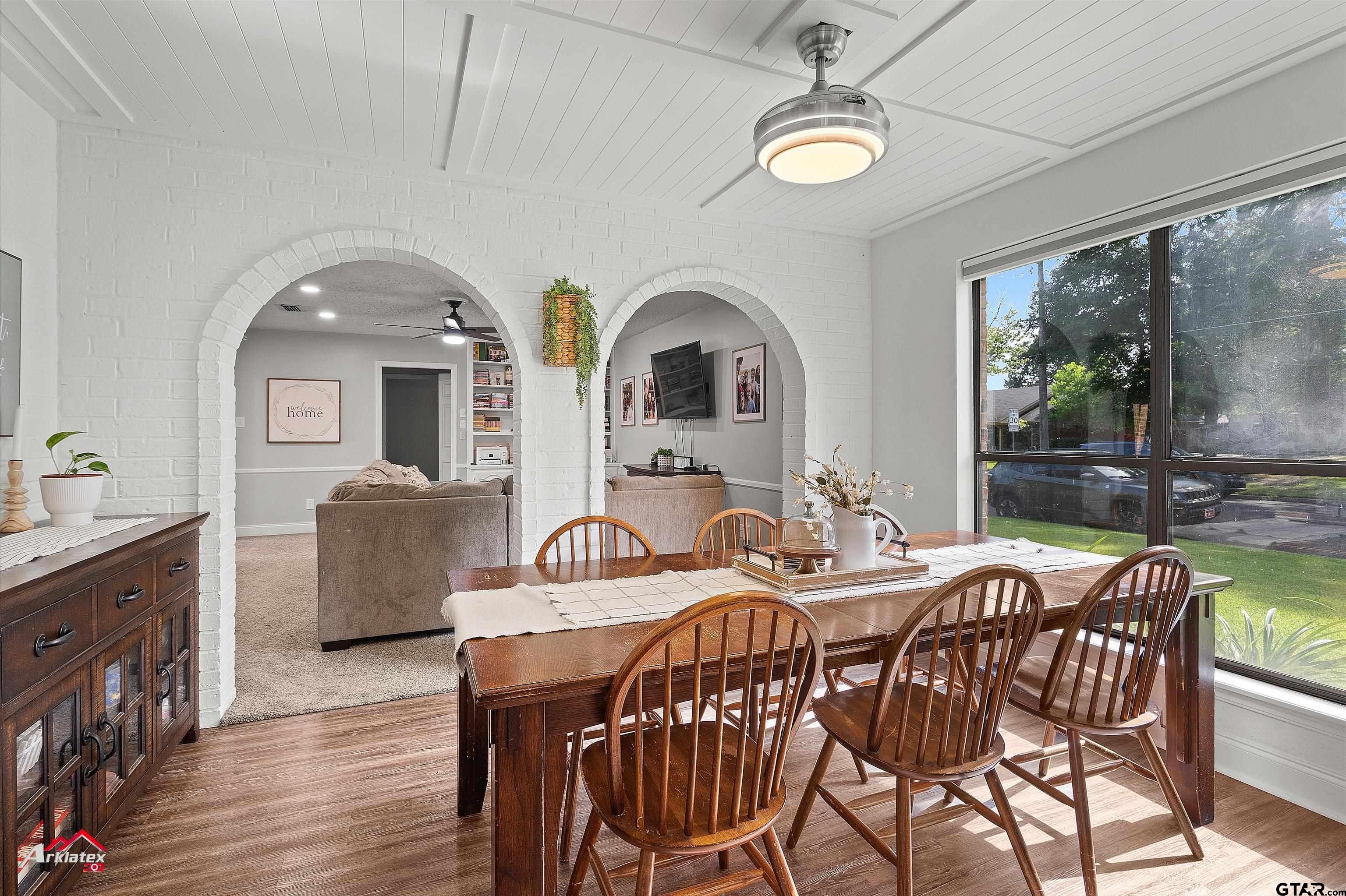 914 Regency Drive Longview, TX 75604 - Photo 22 of 35 a view of a dining room with furniture window and wooden floor