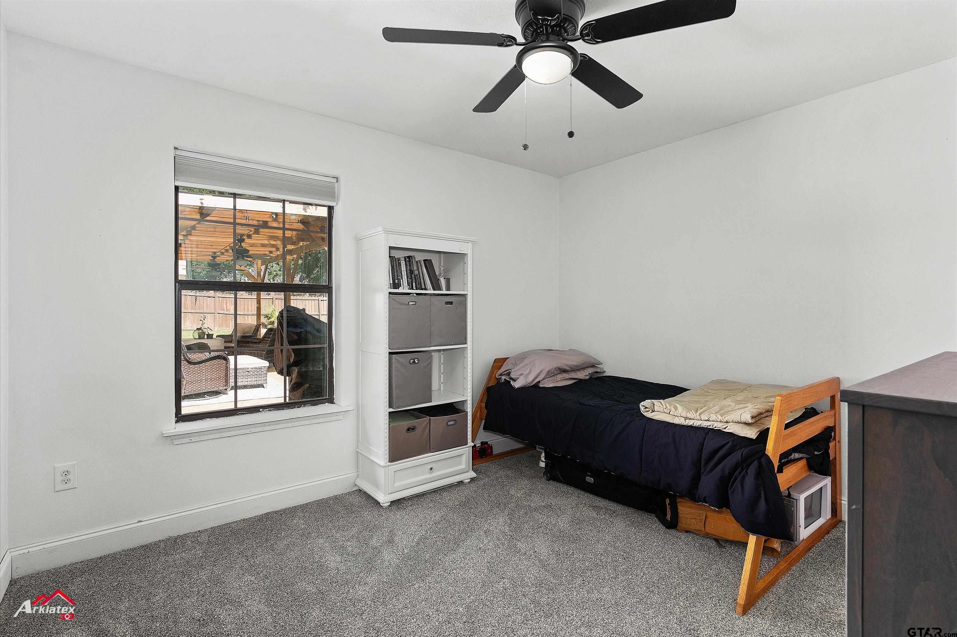 914 Regency Drive Longview, TX 75604 - Photo 25 of 35 a bedroom with a bed and a window