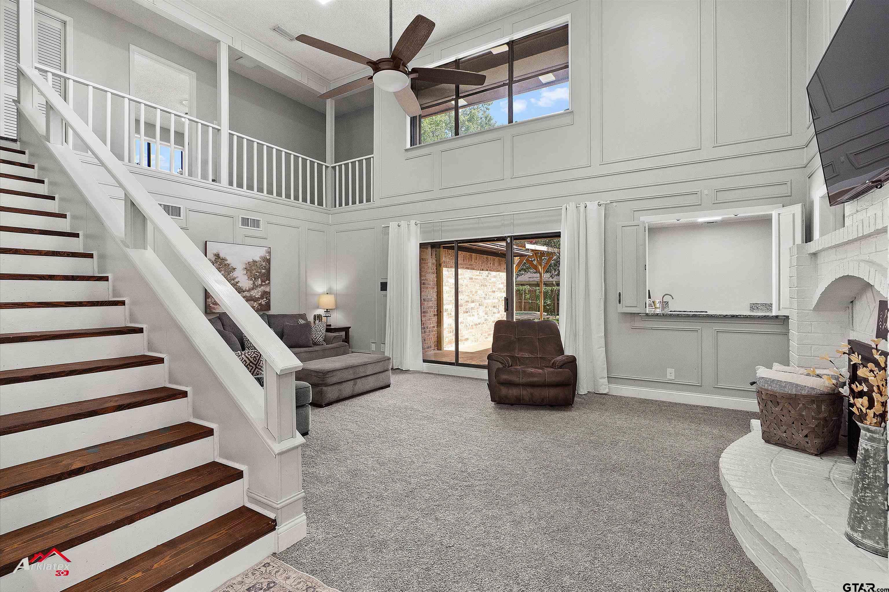 914 Regency Drive Longview, TX 75604 - Photo 7 of 35 a living room with furniture and a chandelier