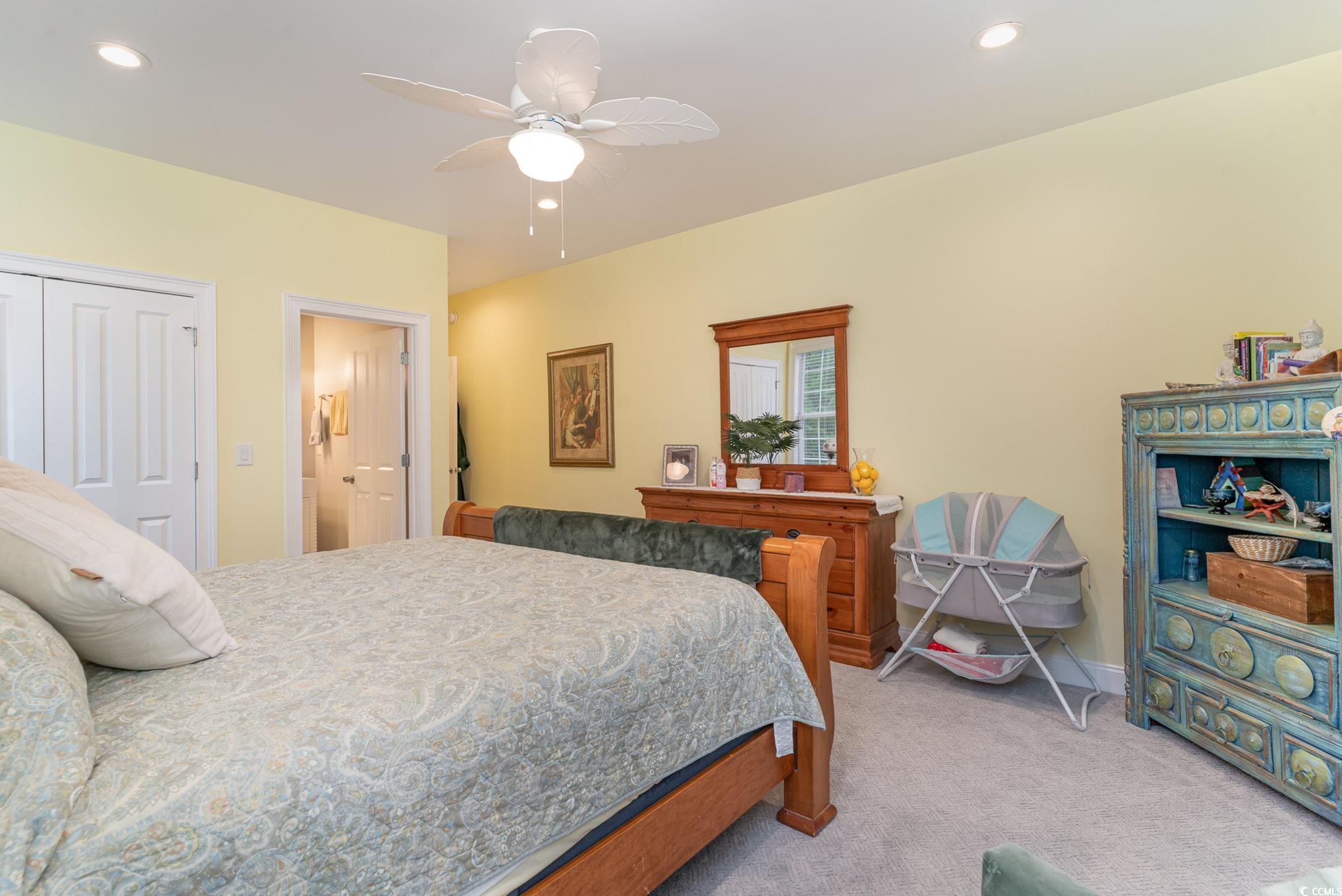 201 Edward Avenue Murrells Inlet, SC 29576 - Photo 16 of 40 Bedroom with ceiling fan, light colored carpet, an