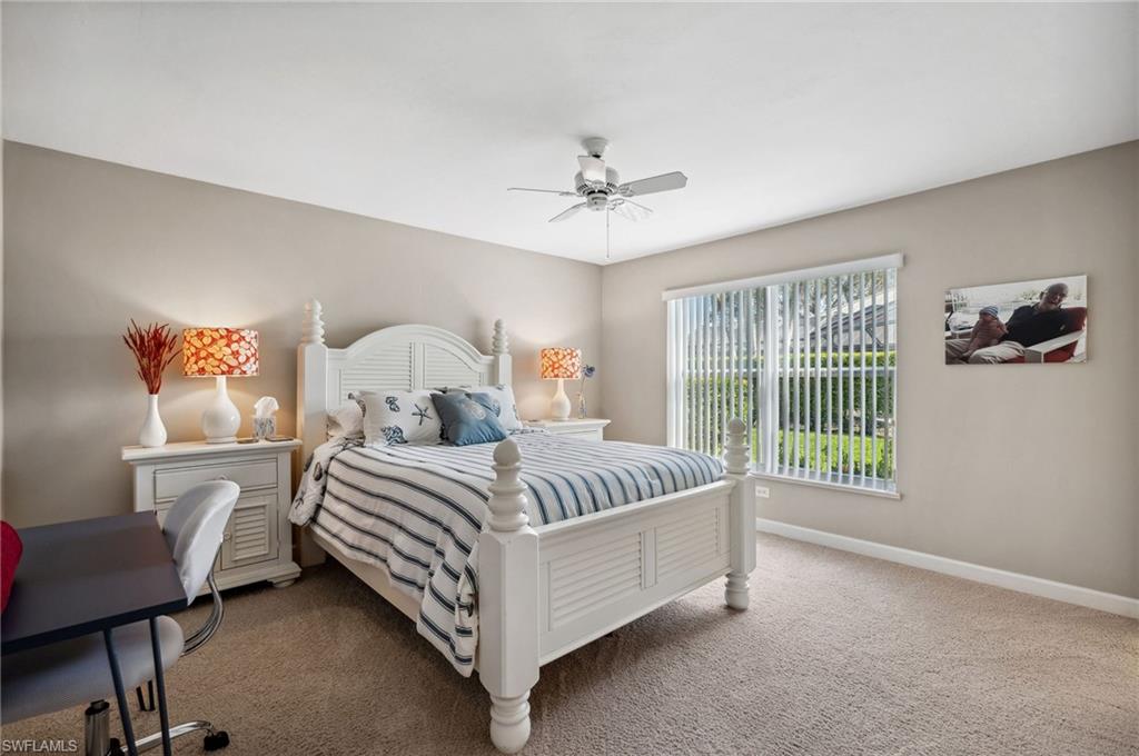 2104 Imperial Golf Course Boulevard Naples, FL 34110 - Photo 20 of 32 a bed room with a bed and a window