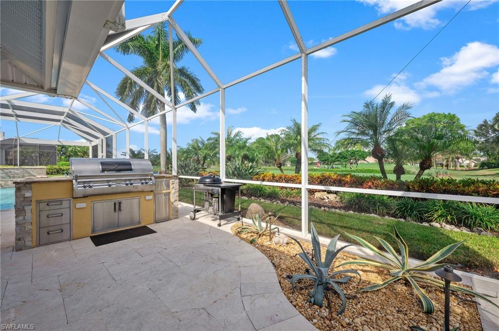 2104 Imperial Golf Course Boulevard Naples, FL 34110 - Photo 27 of 32 a view of a chair and tables in the balcony