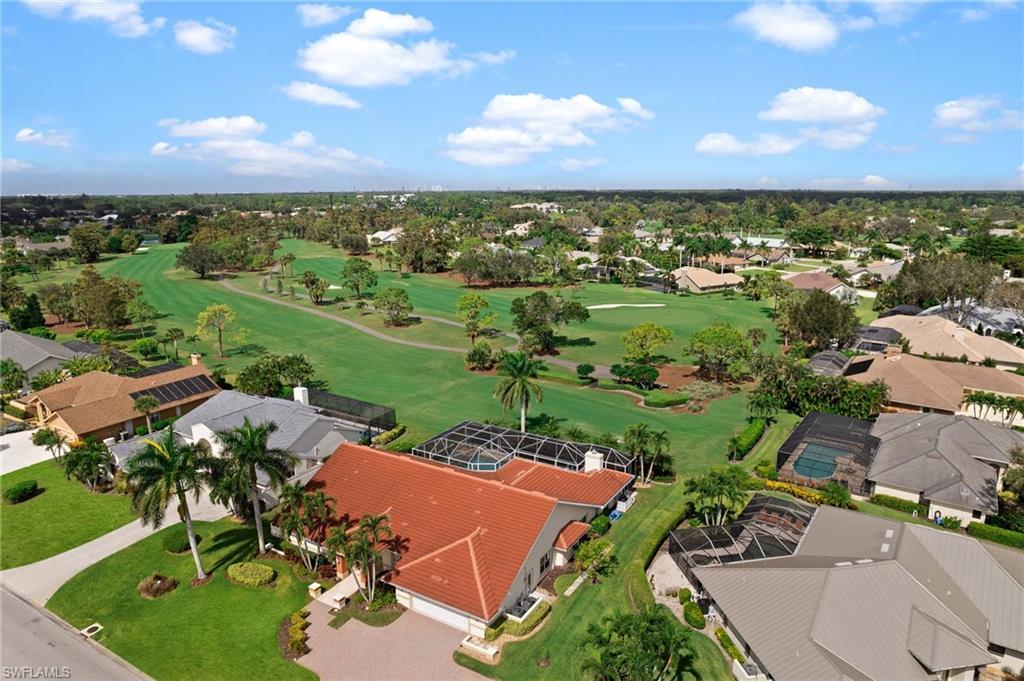 2104 Imperial Golf Course Boulevard Naples, FL 34110 - Photo 30 of 32 an aerial view of a house with a garden
