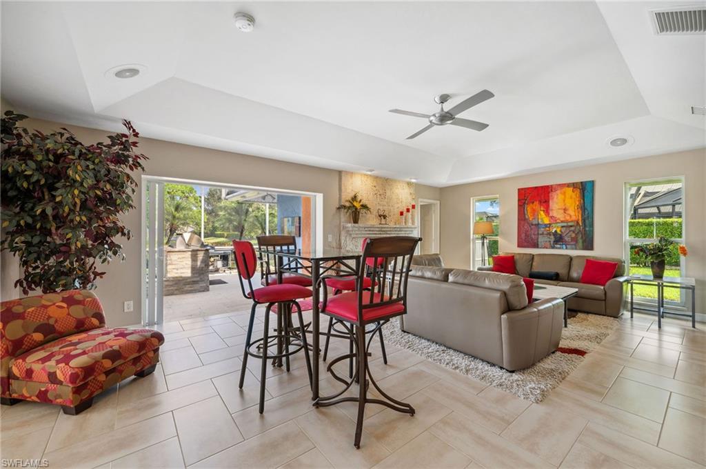 2104 Imperial Golf Course Boulevard Naples, FL 34110 - Photo 6 of 32 a living room with furniture and a potted plant