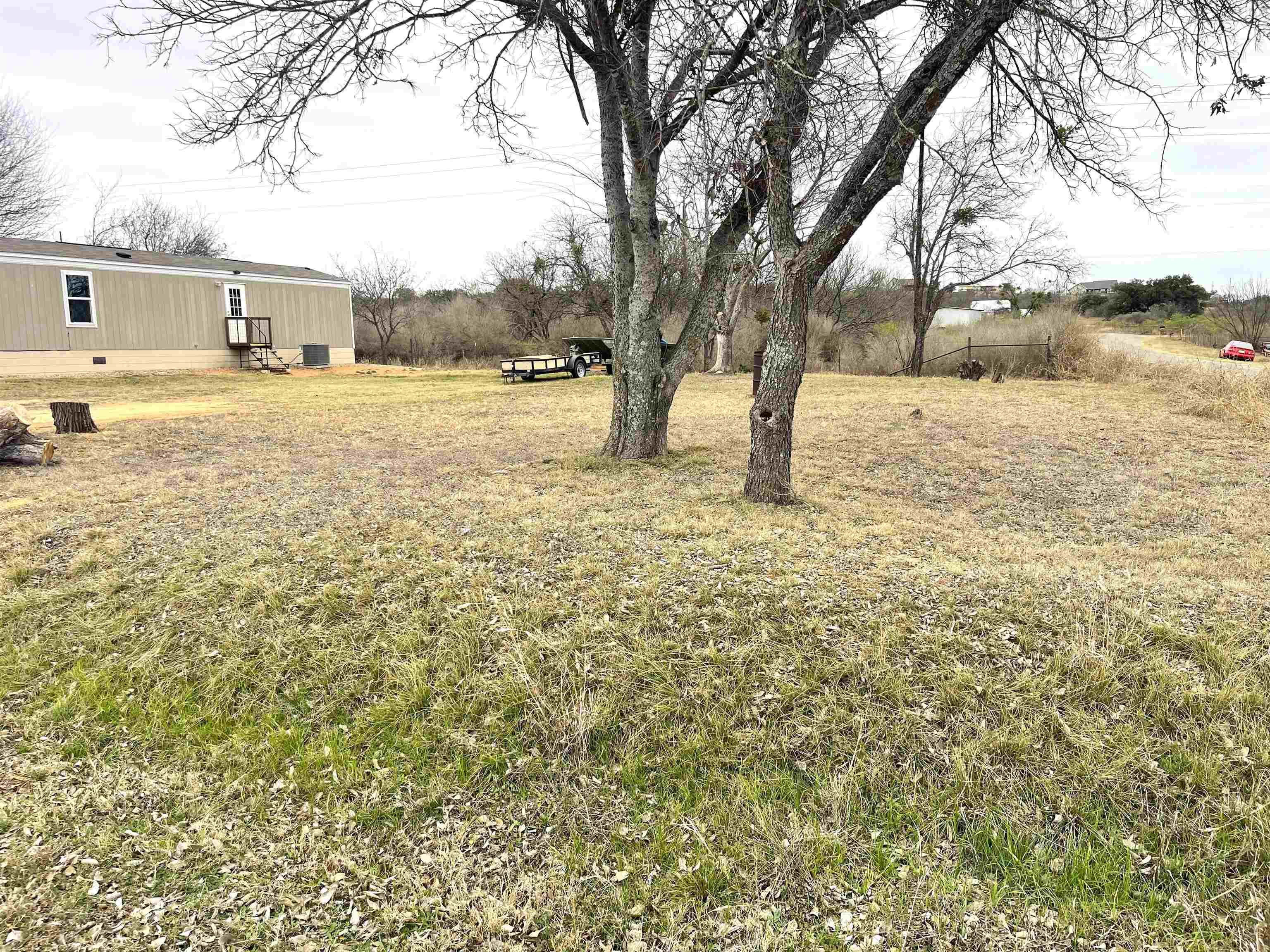 800 East Collins Street Llano, TX 78643 - Photo 1 of 2 a view of yard covered with snow in front of house
