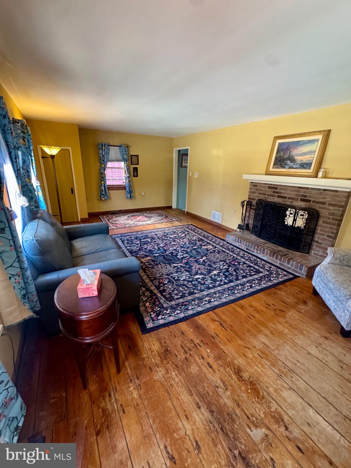 18 Market Street Salem, NJ 08079 - Photo 13 of 39 a living room with furniture and a wooden floor