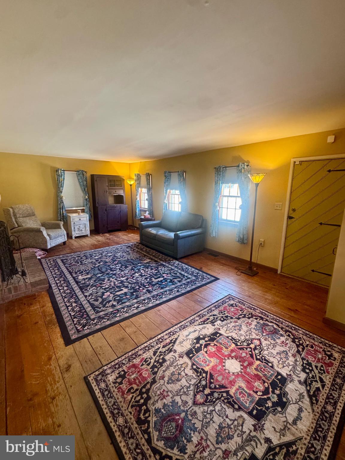 18 Market Street Salem, NJ 08079 - Photo 14 of 39 a bedroom with a bed rug and wooden floor